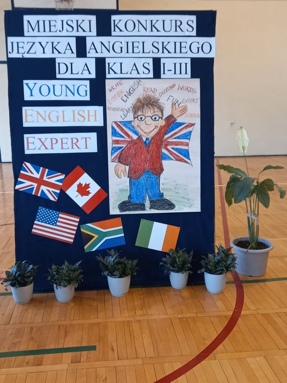 Plakat promujący konkurs. Napis: Miejski Konkurs Języka Angielskiego dla klas I-III "Young English Expert" i flagi angielskie